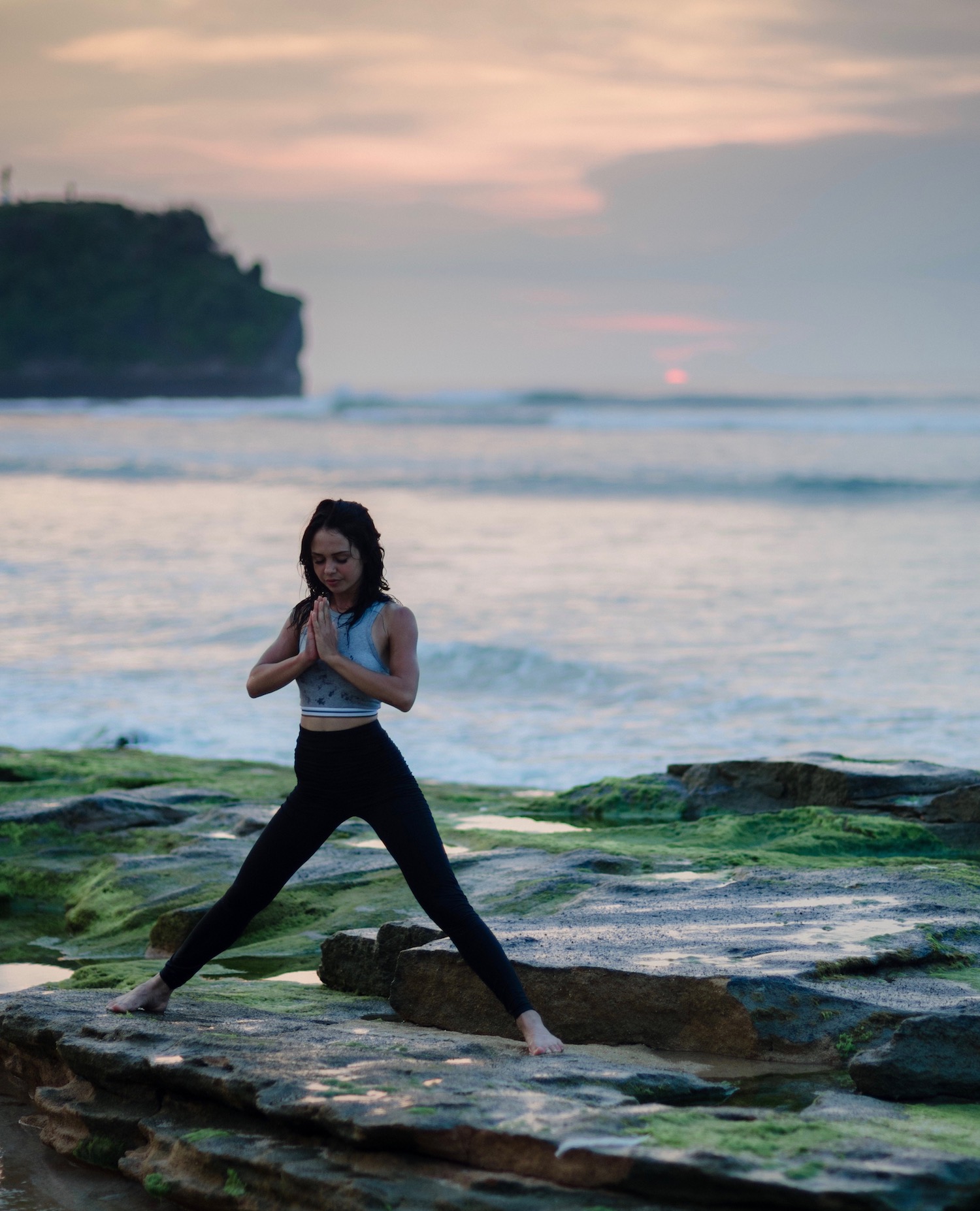 woman-doing-yoga-on-rocks