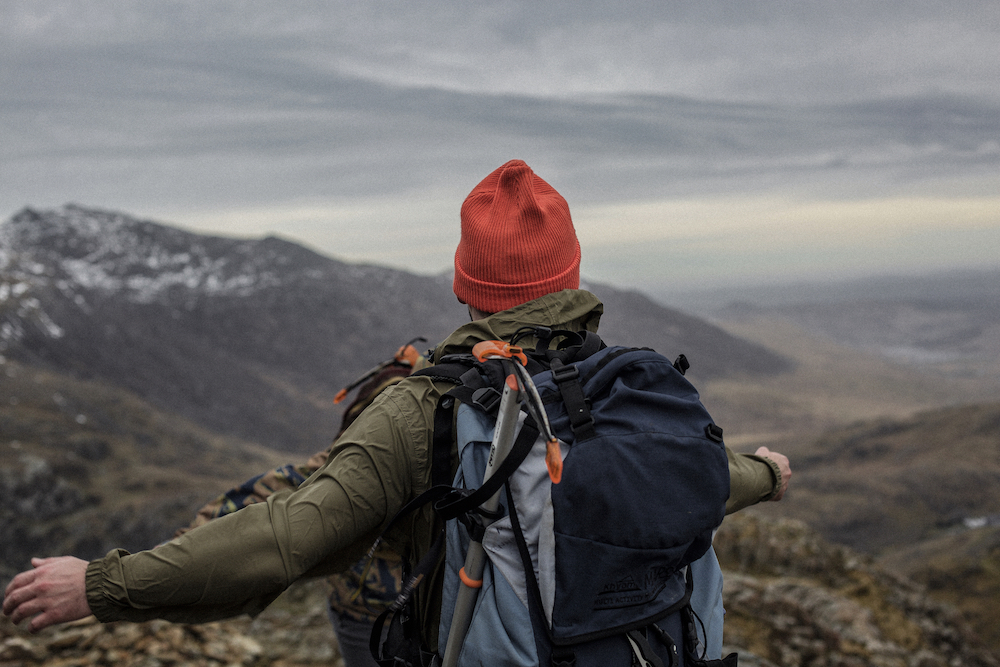 A mountain climber's view from the top of a peak