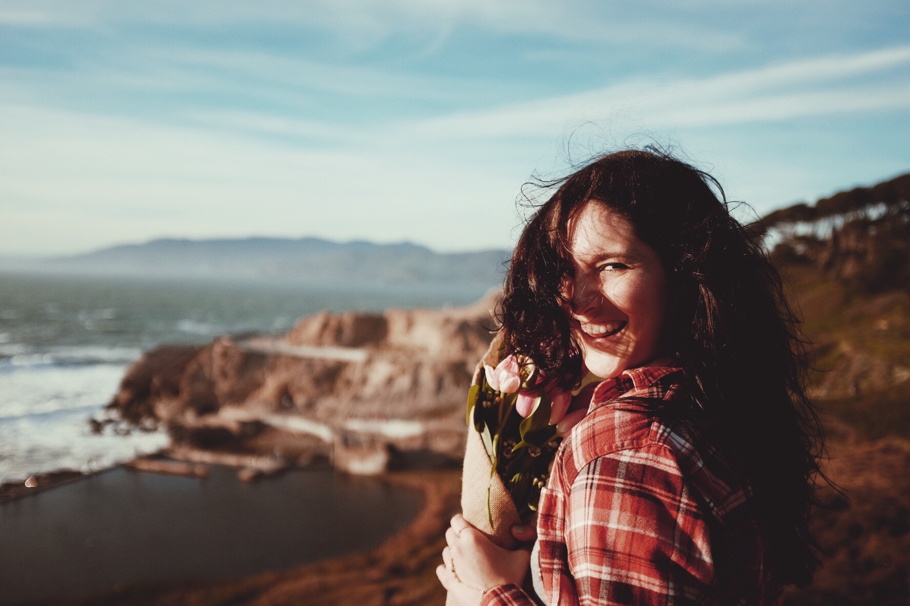 A happy young woman enjoying the out-of-doors