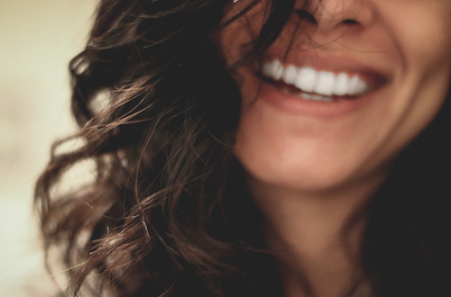 Woman with brown hair smiling