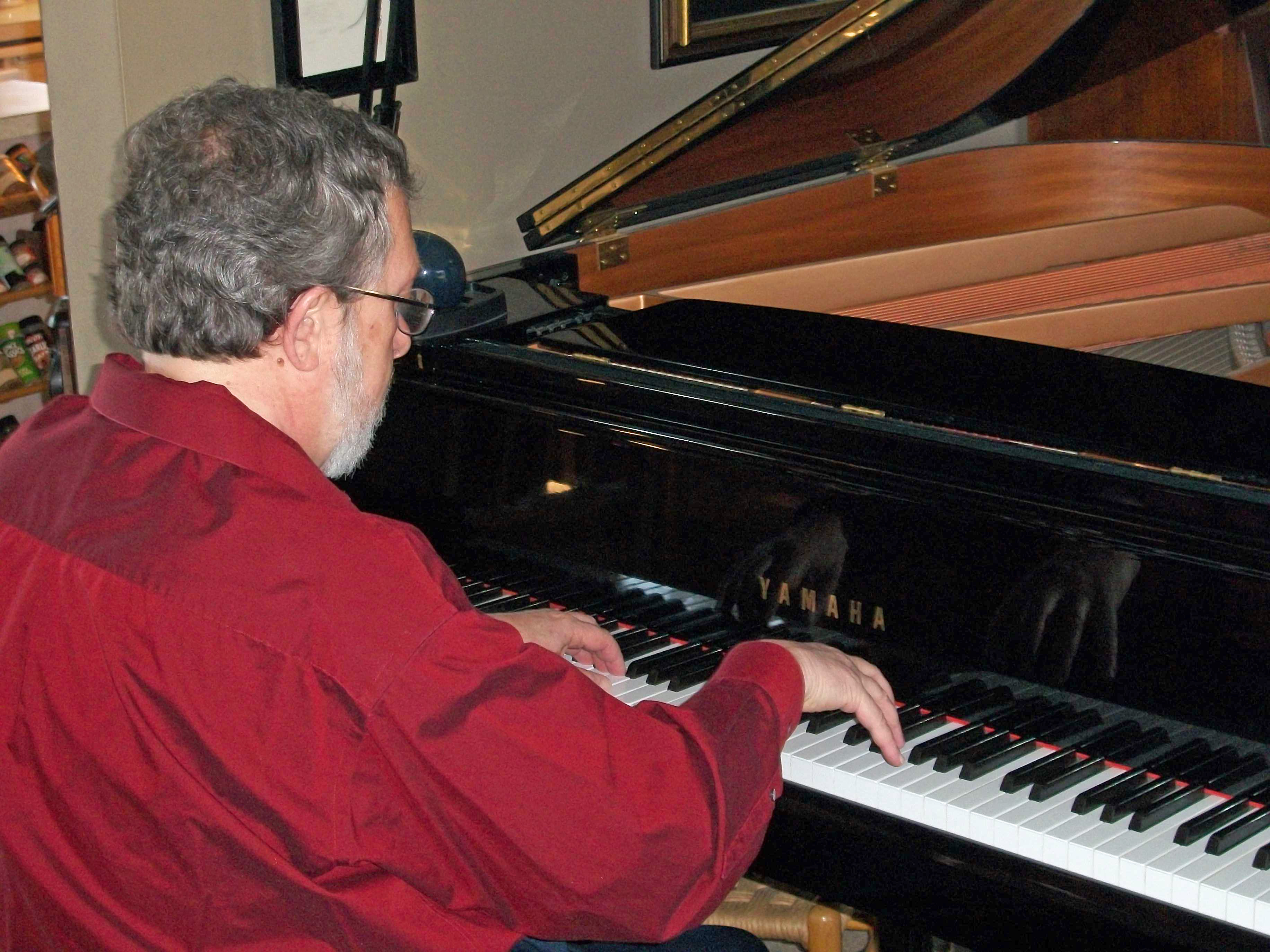 Grover Farr, Music Teacher, playing piano