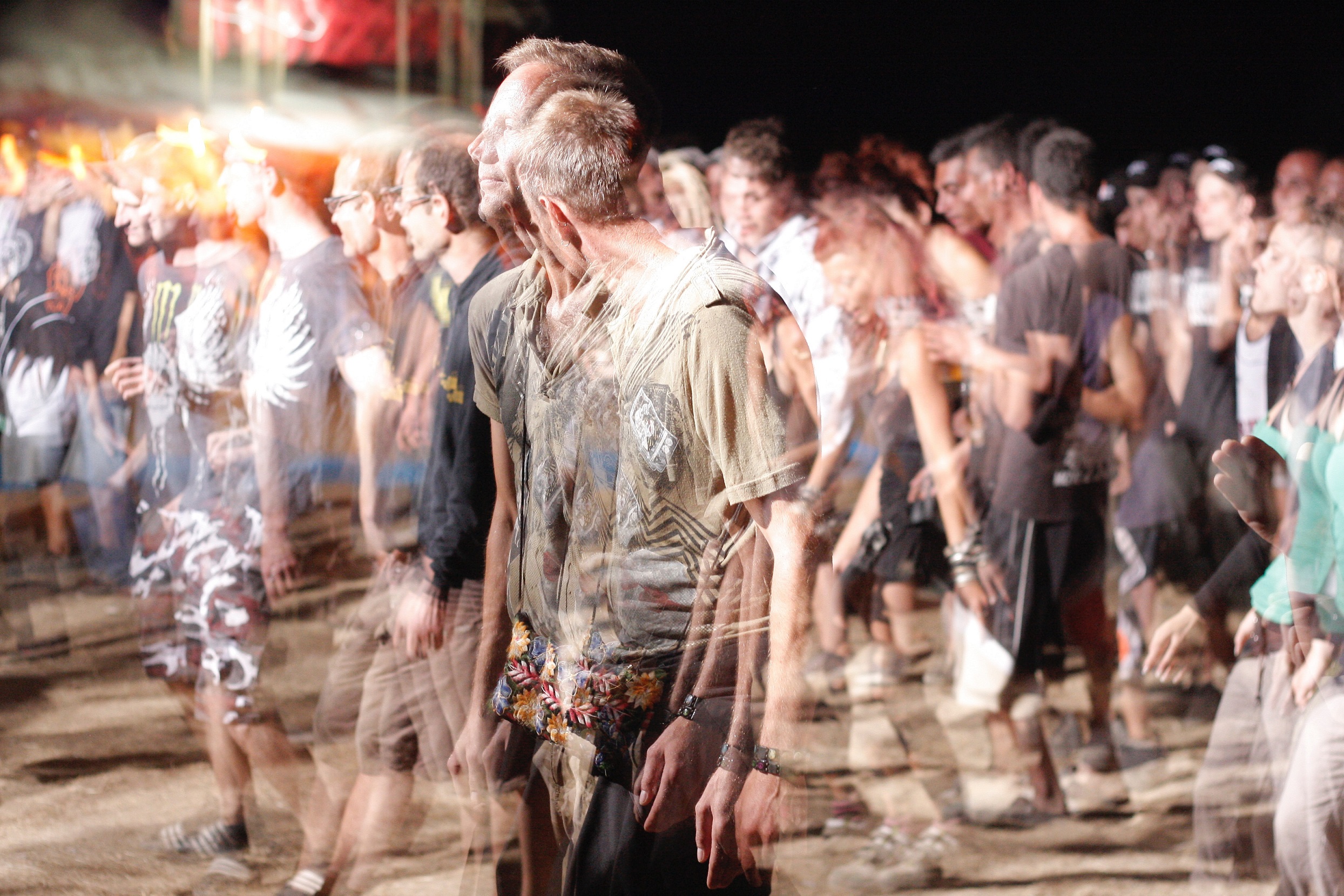 Slow shutter photo of man at an outdoor party