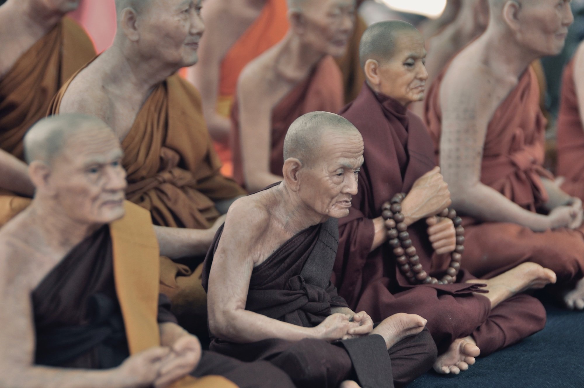 Elderly Buddhists meditating